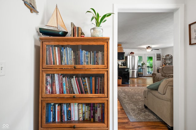 interior space with a textured ceiling and dark hardwood / wood-style floors