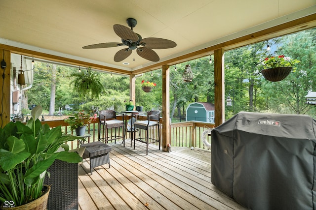 sunroom / solarium featuring ceiling fan