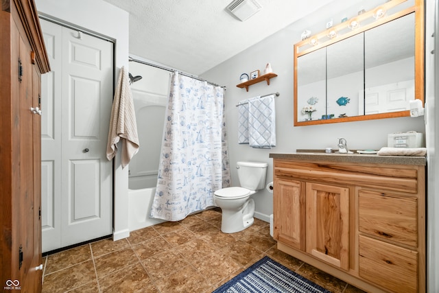 full bathroom with vanity, toilet, a textured ceiling, and shower / tub combo with curtain