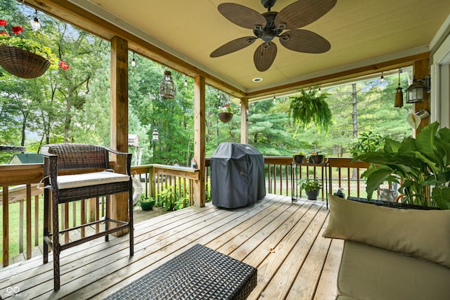 deck with ceiling fan and a grill