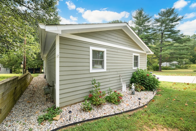 view of property exterior featuring a yard