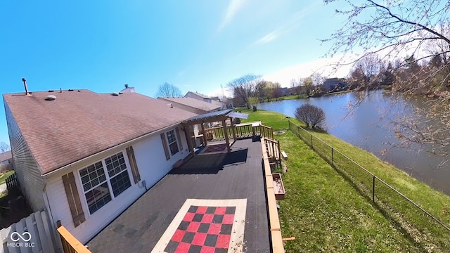 view of property exterior featuring a deck with water view