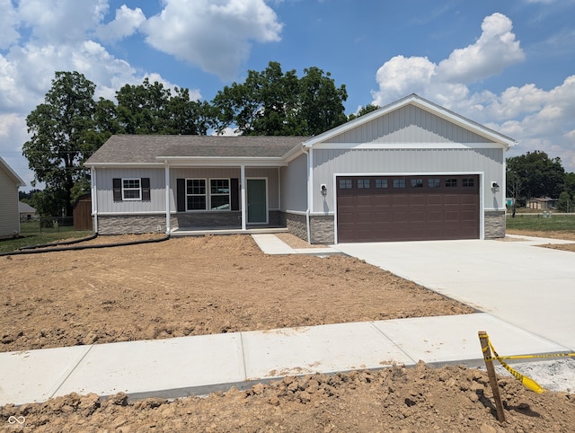 view of front of home with a garage and covered porch