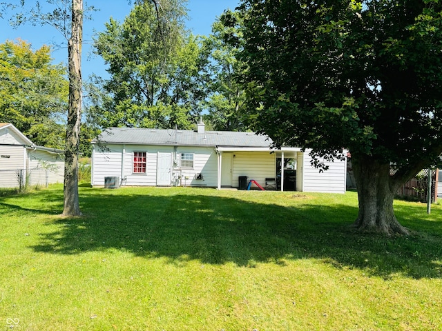 ranch-style home featuring a front yard