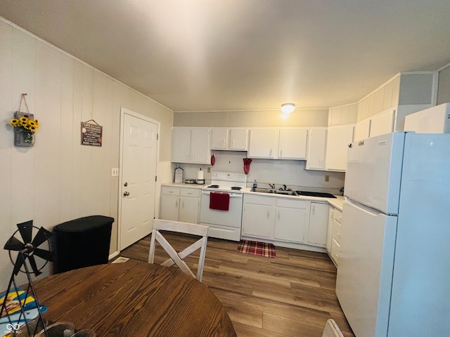 kitchen featuring sink, white appliances, white cabinetry, and dark hardwood / wood-style flooring