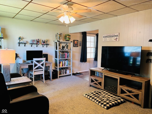 carpeted living room with ceiling fan