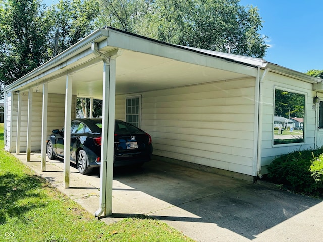 view of vehicle parking with a carport