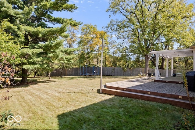 view of yard featuring a deck and a pergola