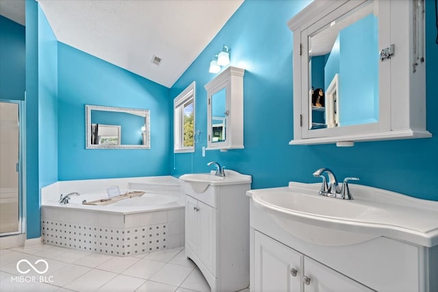 bathroom featuring vanity, separate shower and tub, vaulted ceiling, and tile patterned floors