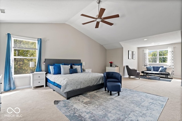 carpeted bedroom with ceiling fan and lofted ceiling