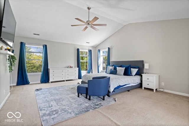 bedroom featuring ceiling fan, lofted ceiling, and light carpet