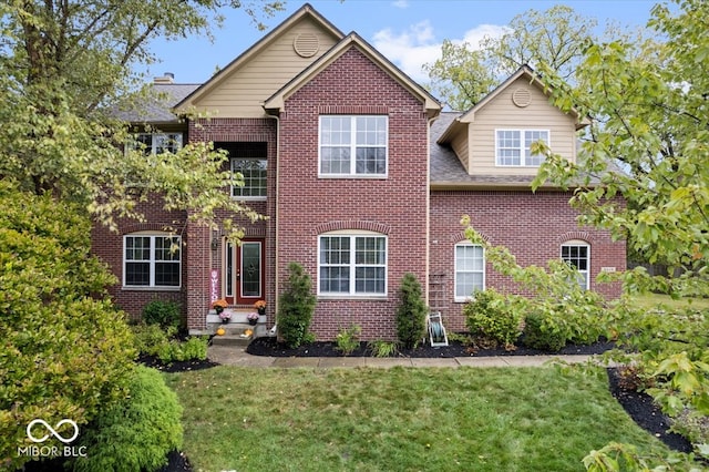 view of front of property with a front lawn