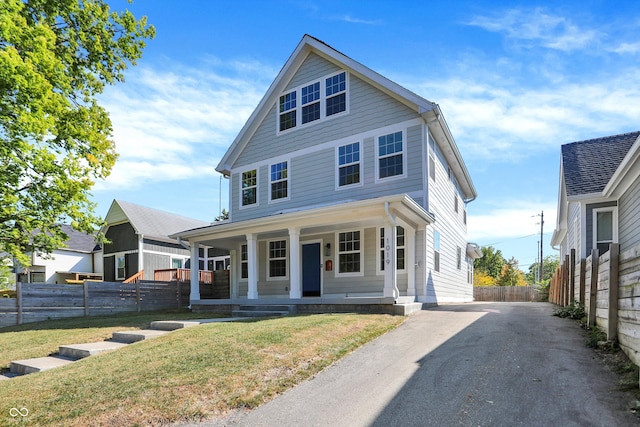 view of front of home with a front lawn and covered porch