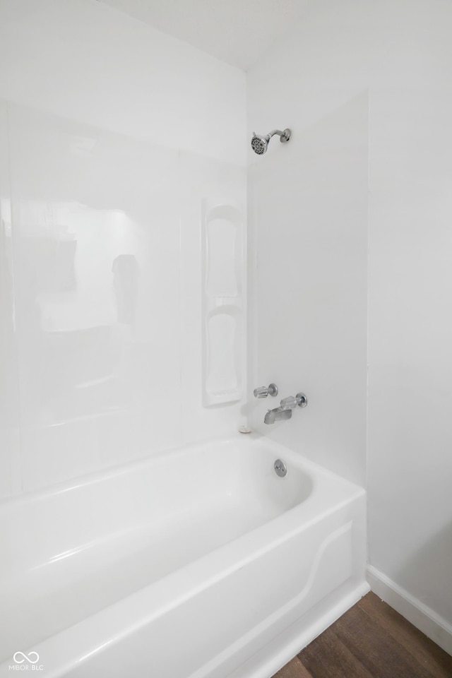 bathroom with shower / tub combination and wood-type flooring