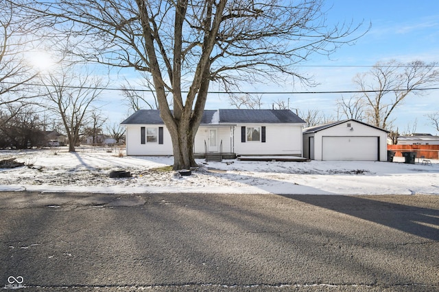 view of front of house featuring a garage and an outdoor structure