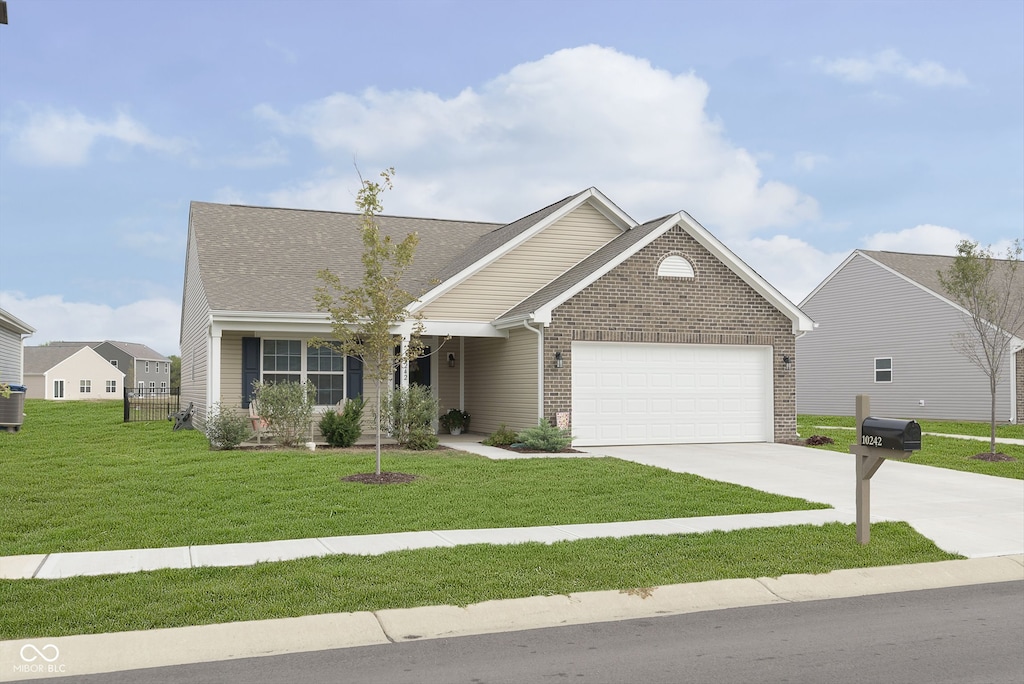 view of front of house with a front lawn and a garage