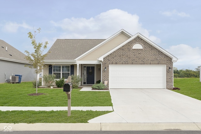 view of front of house with a garage, central AC, and a front yard