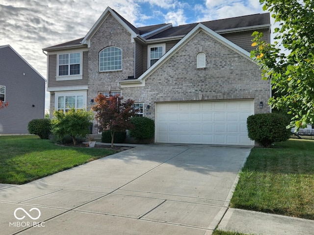 view of front property featuring a garage and a front yard