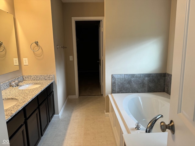 bathroom featuring vanity and a bathing tub