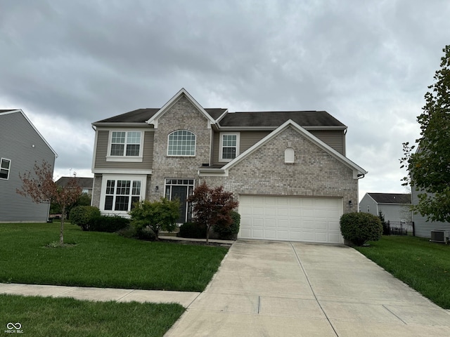 view of front of home with a front lawn and a garage