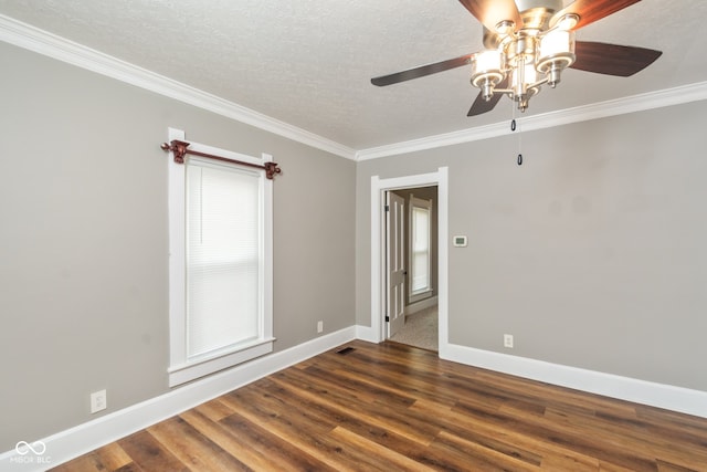 spare room with ceiling fan, crown molding, a textured ceiling, and dark hardwood / wood-style flooring