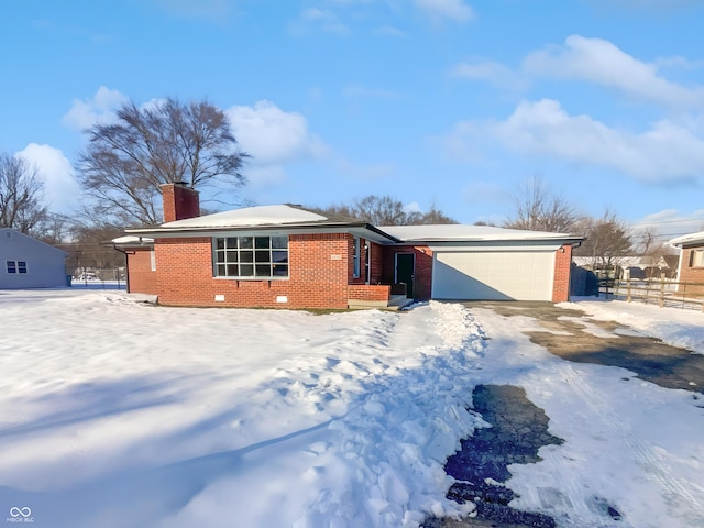 ranch-style house featuring a garage