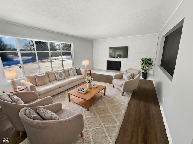 living room featuring a textured ceiling and light wood-type flooring