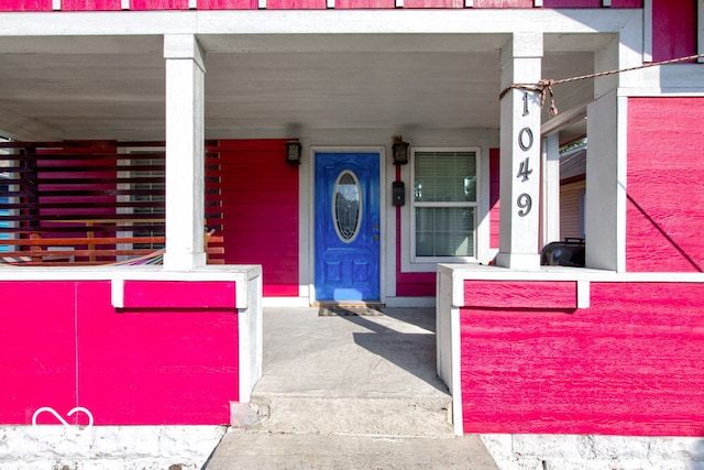 property entrance with a porch