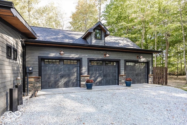 garage featuring wooden walls