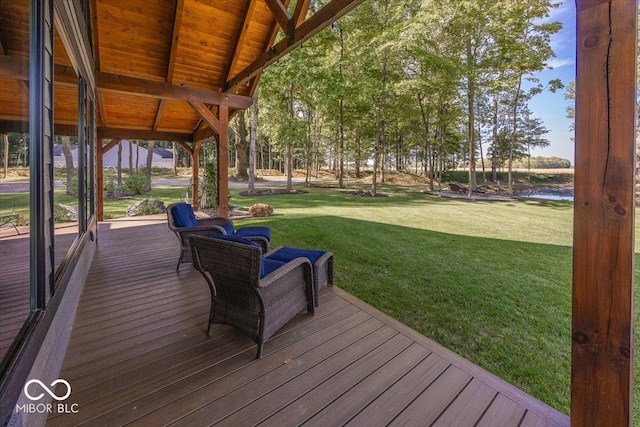 wooden deck with a lawn