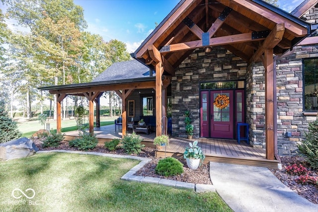 view of exterior entry featuring a yard