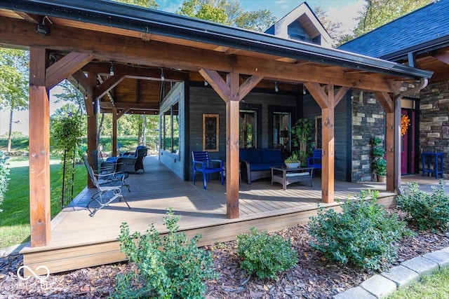 wooden terrace with outdoor lounge area