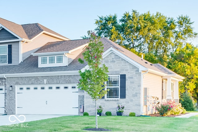 view of front facade with a front yard and a garage