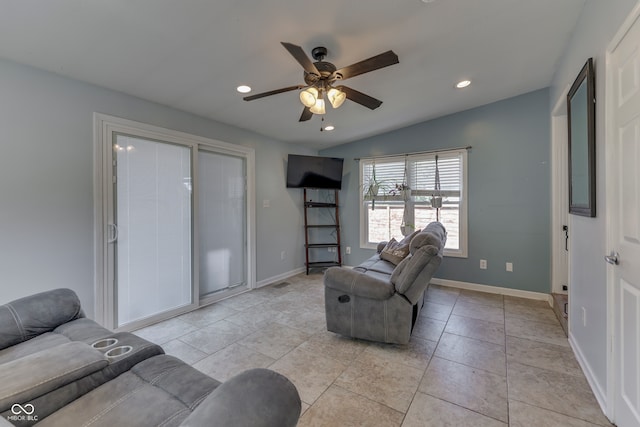 tiled living room featuring vaulted ceiling and ceiling fan