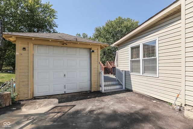 garage featuring wood walls