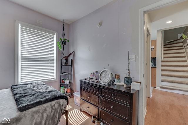 bedroom with light hardwood / wood-style floors