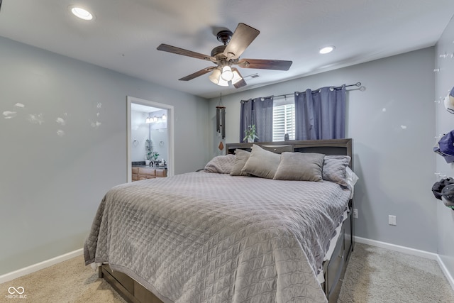 carpeted bedroom featuring connected bathroom and ceiling fan