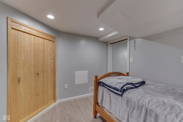 bedroom featuring a closet and light hardwood / wood-style floors