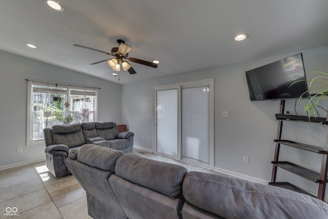 tiled living room featuring lofted ceiling and ceiling fan