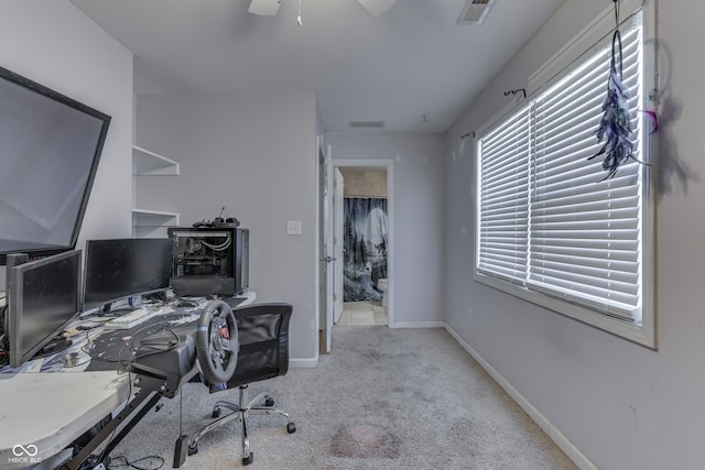 carpeted office with ceiling fan