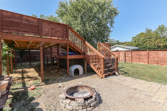 view of patio with a fire pit and a wooden deck