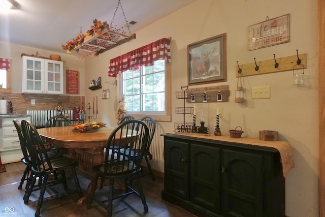 dining area featuring dark hardwood / wood-style floors