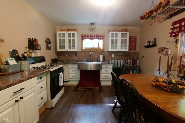 kitchen with white cabinets, sink, tasteful backsplash, dark wood-type flooring, and white gas stove