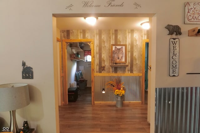 hallway with hardwood / wood-style floors