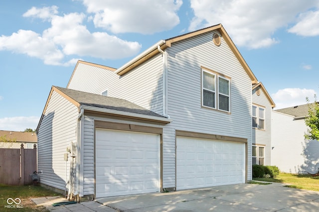 view of property exterior featuring a garage