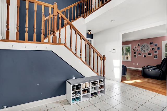 stairs featuring hardwood / wood-style floors