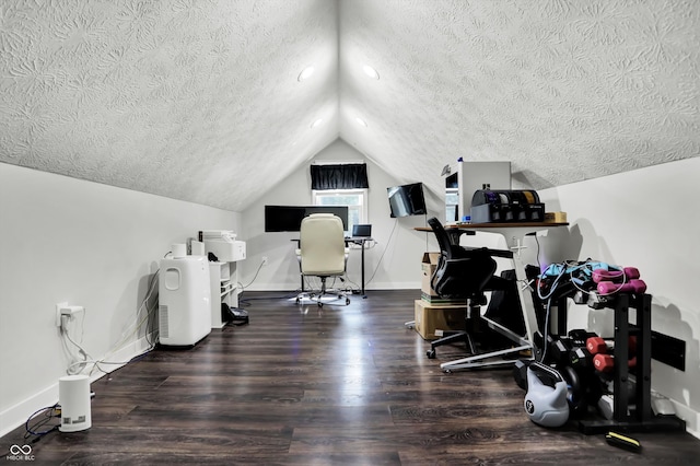 workout area with wood-type flooring, a textured ceiling, and lofted ceiling