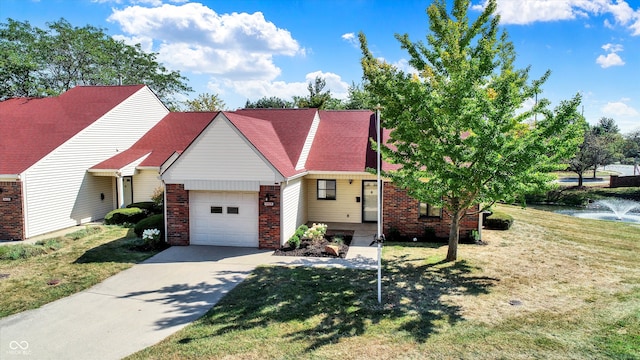 view of front of home featuring a front yard and a garage