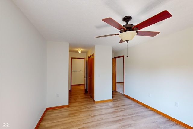 unfurnished room featuring light hardwood / wood-style floors and ceiling fan