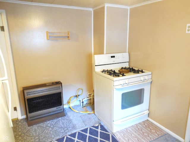 kitchen with heating unit, ornamental molding, and white range with gas cooktop